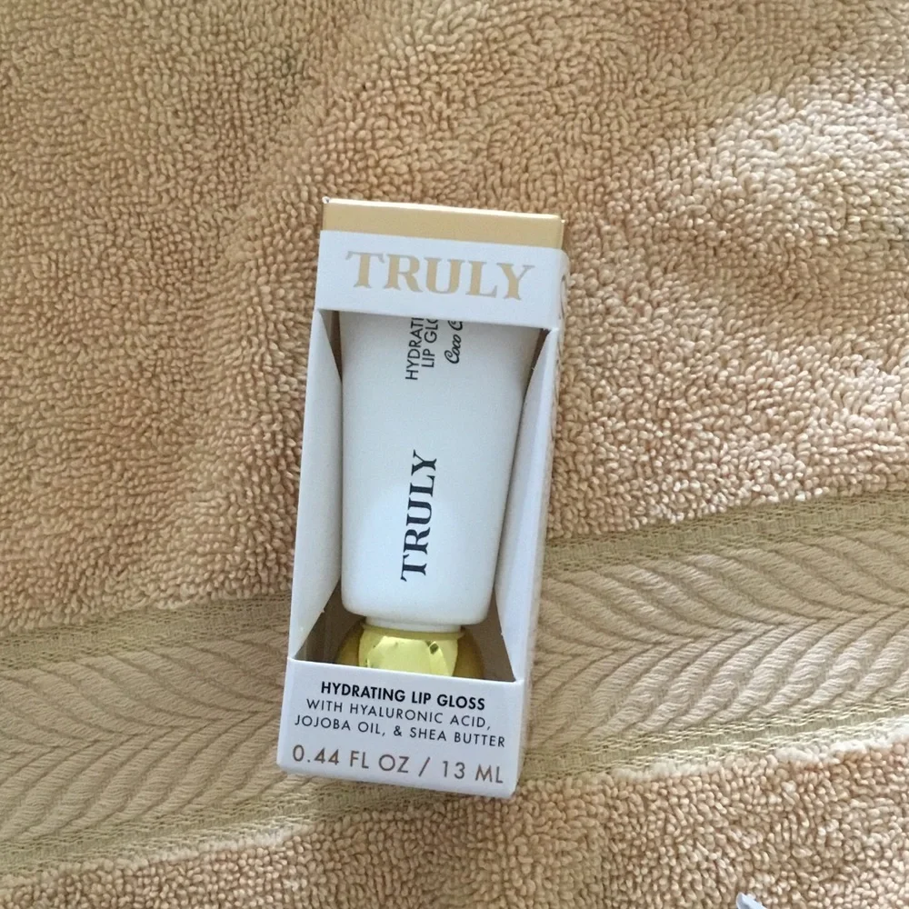 TRULY White and Gold Hydrating Lip Gloss in Branded Packaging